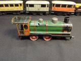 a small toy train that is sitting on a table