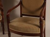 pair of antique mahogany chairs with upholstered upholstered arms
