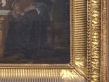 painting of a man and a woman seated at a table in a room