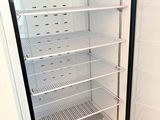 an image of an empty refrigerator with the door open