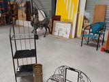 a room with a shelf, chair, chair, and other items in it