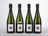 trois bouteilles de vin posées sur une table