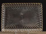 an image of a clear glass plate with a gold rim