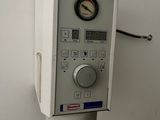 a control panel on the wall of a small room