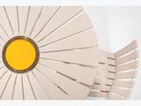 a picture of a white chair with a yellow center