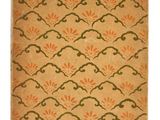 un tapis marron et vert avec un motif dessus