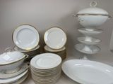 a lot of plates and bowls on the table