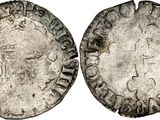 a silver coin with an image of a woman on it