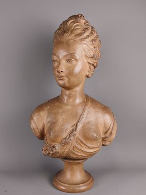 marble bust of a woman with braided hair on a pedestal
