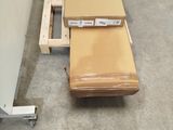 a box sitting on top of a carton in a warehouse