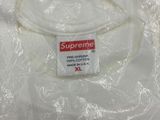 white supreme t - shirt with red supreme logo on the front