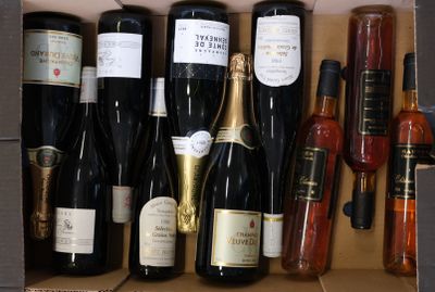 many bottles of wine in a box on the table