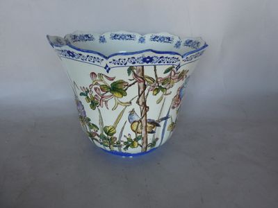 a blue and white vase with birds and flowers on it
