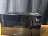 an image of a microwave oven on a wooden table