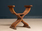 an image of a wooden chair sitting on top of a cement floor