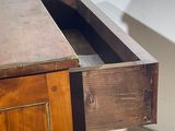 a wooden desk with a drawer underneath it