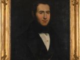 portrait of a gentleman in a black suit and white shirt