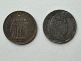 an old coin with a picture of a man and a woman on it