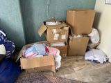 a pile of boxes and other items in a room