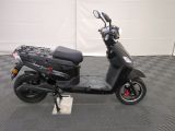a scooter that is parked in a garage