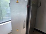 an image of a stainless steel refrigerator in a room
