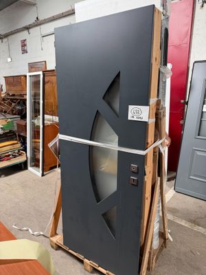 an image of a refrigerator in a warehouse with a lot of wood