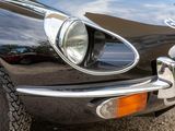 a close up of a car ' s headlight on a black car