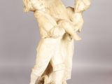 an image of a statue of a man holding a child