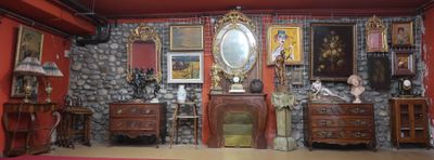 an image of a living room with red walls and furniture