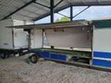 a blue and white food truck parked in a building