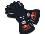 a pair of black gloves with red bull logos on them