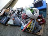 a pile of junk on the ground next to a car