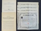 two old documents are sitting on a table next to each other