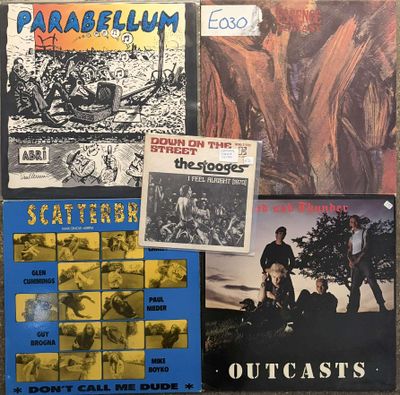 a group of various vinyl records on a table