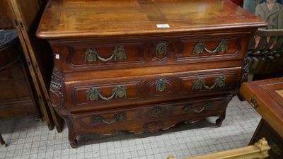 a wooden chest of drawers with a mirror on top of it