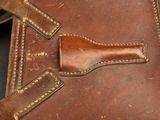 a piece of luggage that has a leather handle on it