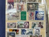 a book with stamps on it sitting on a table