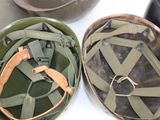 two helmets sitting next to each other on a table