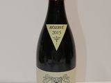 a bottle of wine that is sitting on a table