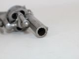 a gun that is laying on a table