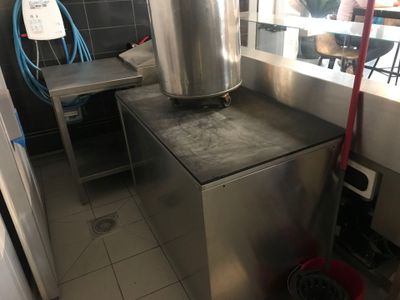 a large pot sitting on top of a counter in a kitchen