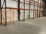 a large warehouse with a lot of shelves and pallets