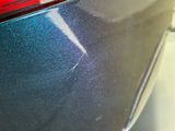 a close up of a car ' s rear end with a blue tint
