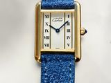 an image of a close up of a wrist watch with roman numerals on it