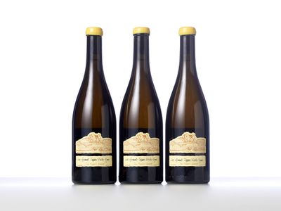 three bottles of wine sitting next to each other on a table