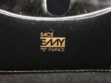 a black purse with a gold logo on it