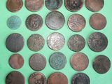 an image of a bunch of old coins on a green surface