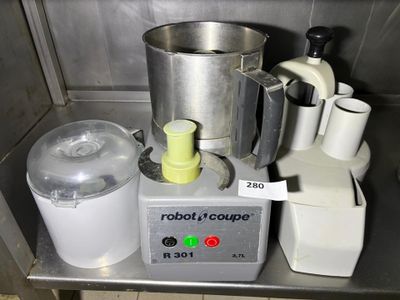 a blender and a blender sitting on a metal counter