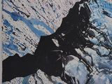 a picture of a snowboarder riding down a snowy slope