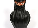 a black vase with a black face and a black hat on it